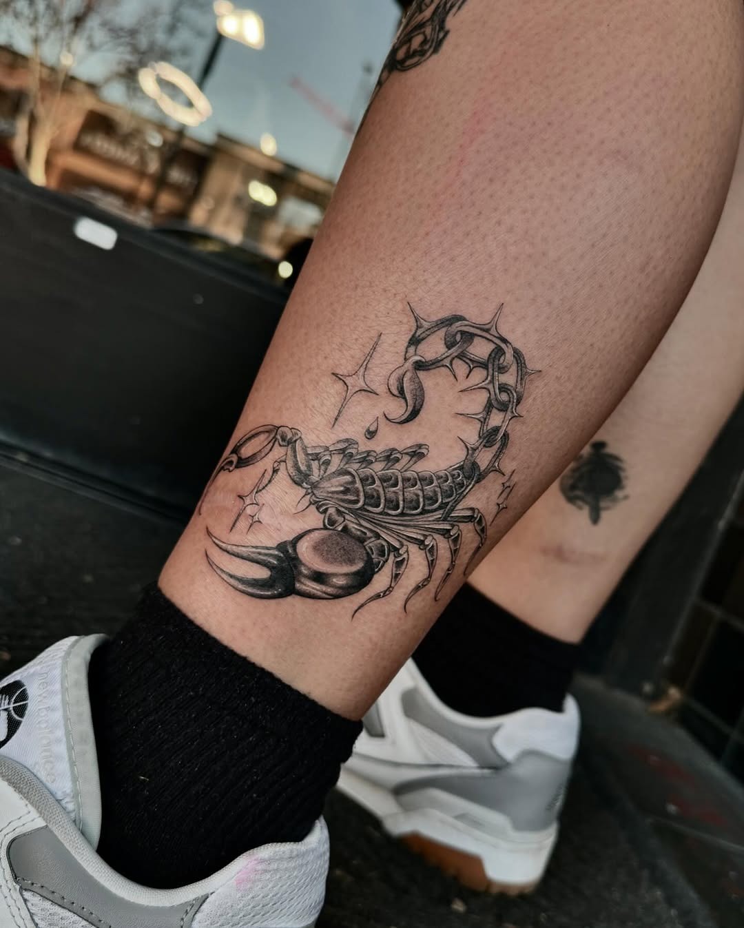 Elegant scorpion tattoo on leg showcases artistry Tattoo Design