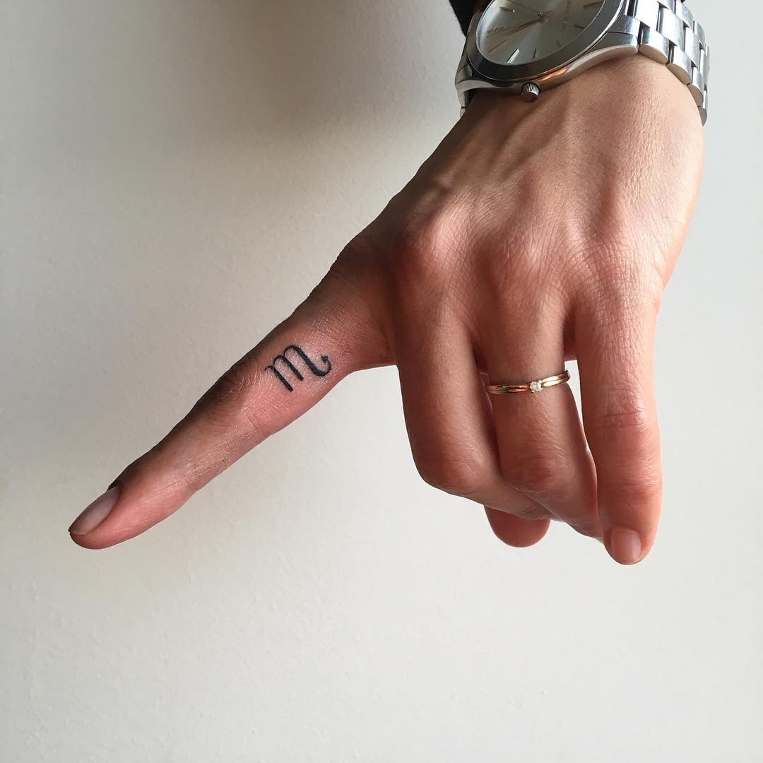 Minimalist scorpio tattoo on a finger Tattoo Design