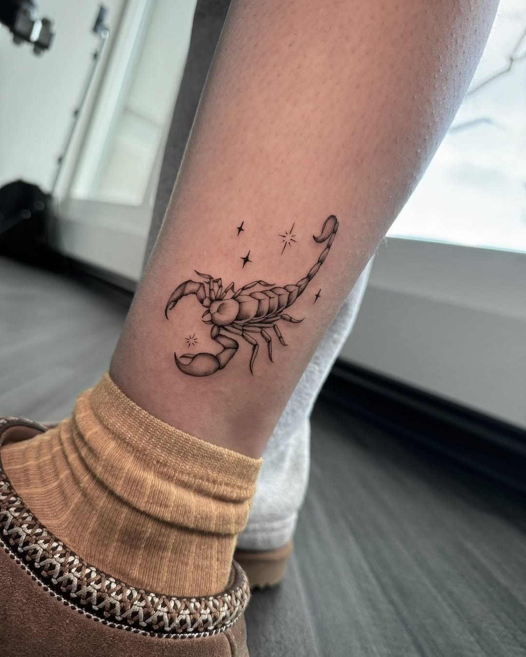 Striking Scorpio Tattoo with Celestial Elements Tattoo Design