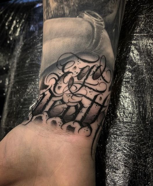 Layered Script and Gothic Wrist Tattoo Tattoo Design