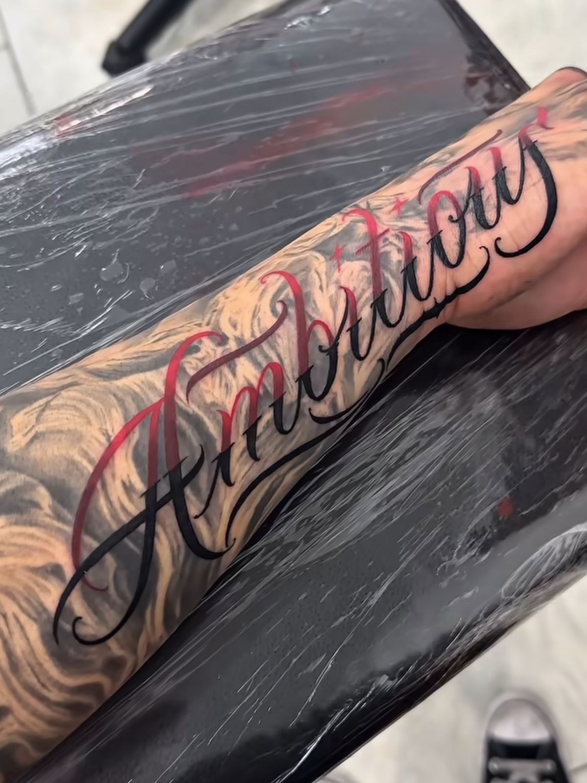 Script Tattoo with Red Accent Lettering Tattoo Design
