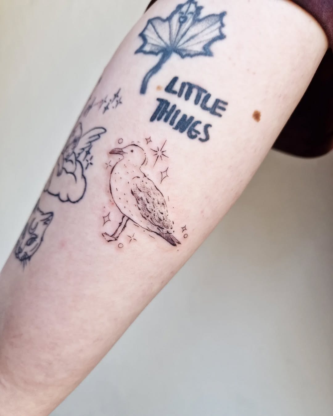Charming minimal seagull tattoo on an arm Tattoo Design