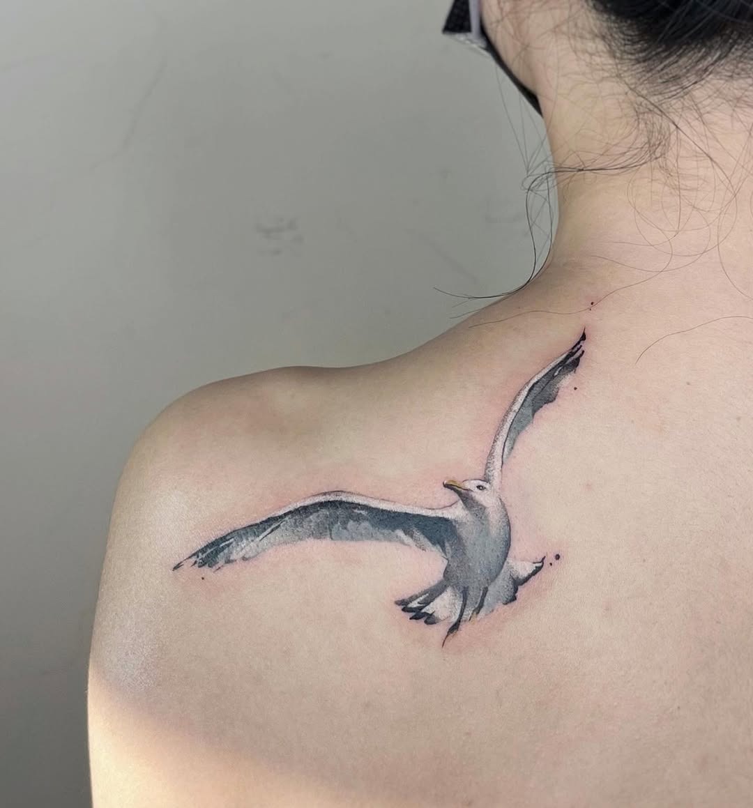 Elegant seagull tattoo in mid-flight Tattoo Design