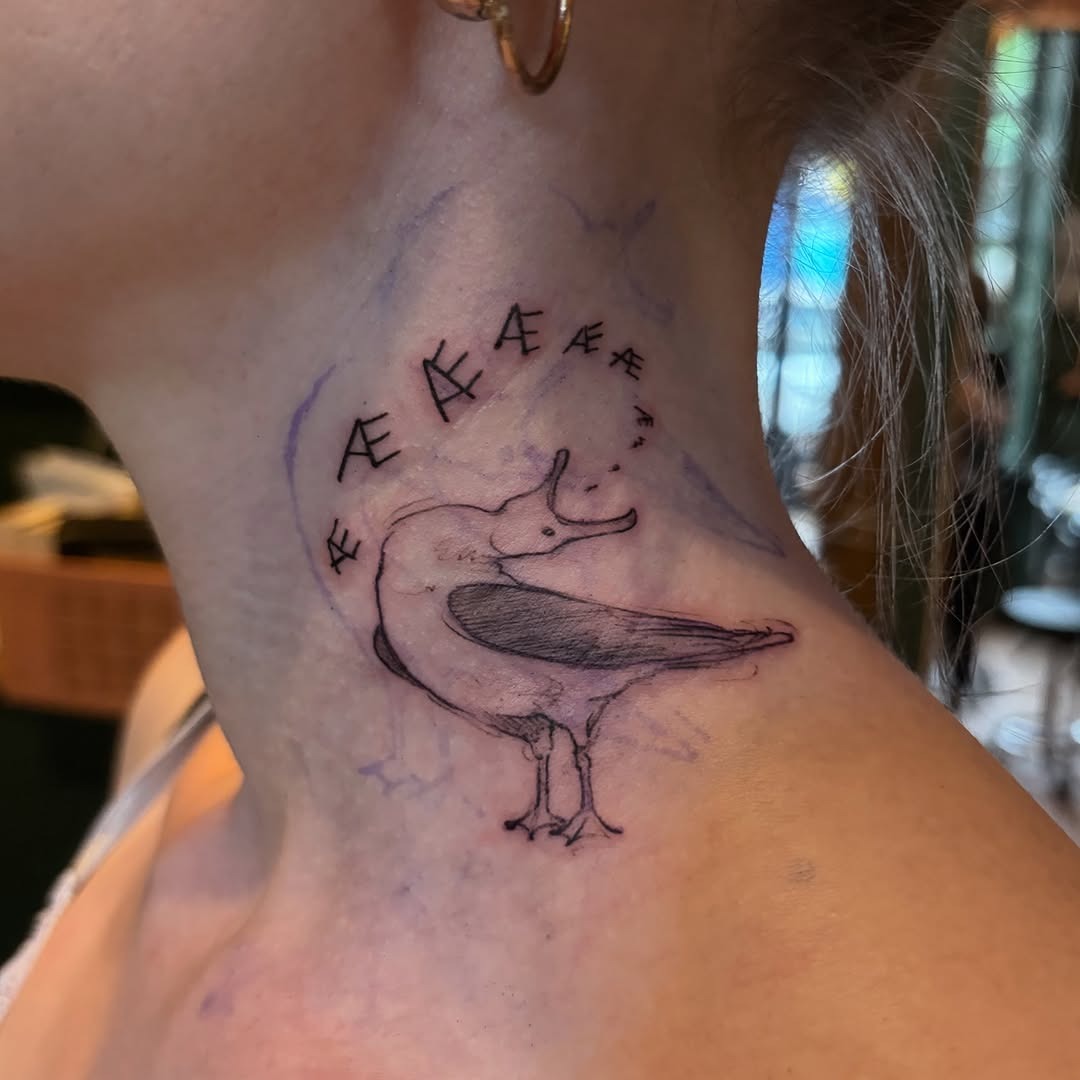 Elegant seagull tattoo on the neck Tattoo Design