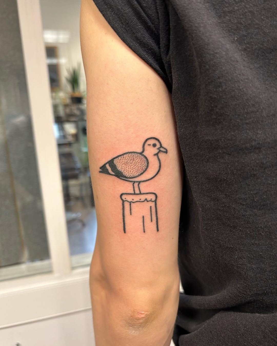 Minimalist seagull tattoo on a vintage pillar Tattoo Design
