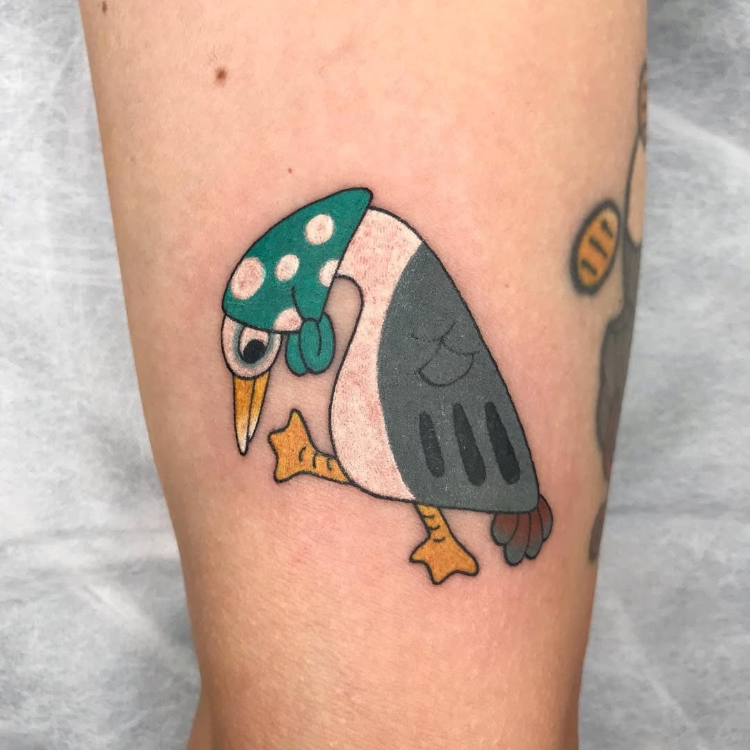 Playful seagull tattoo with vibrant colors Tattoo Design