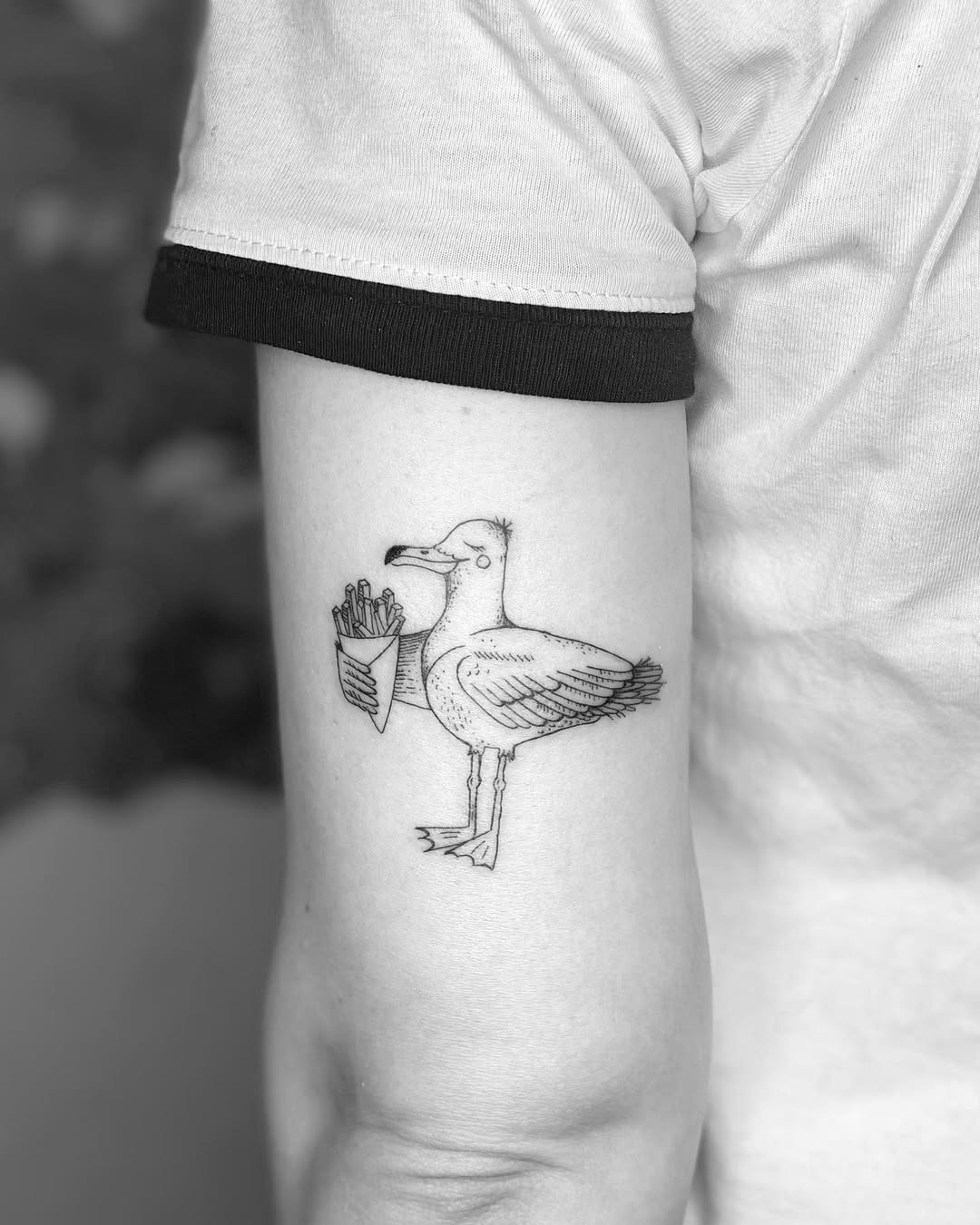 Unique seagull tattoo with playful design Tattoo Design
