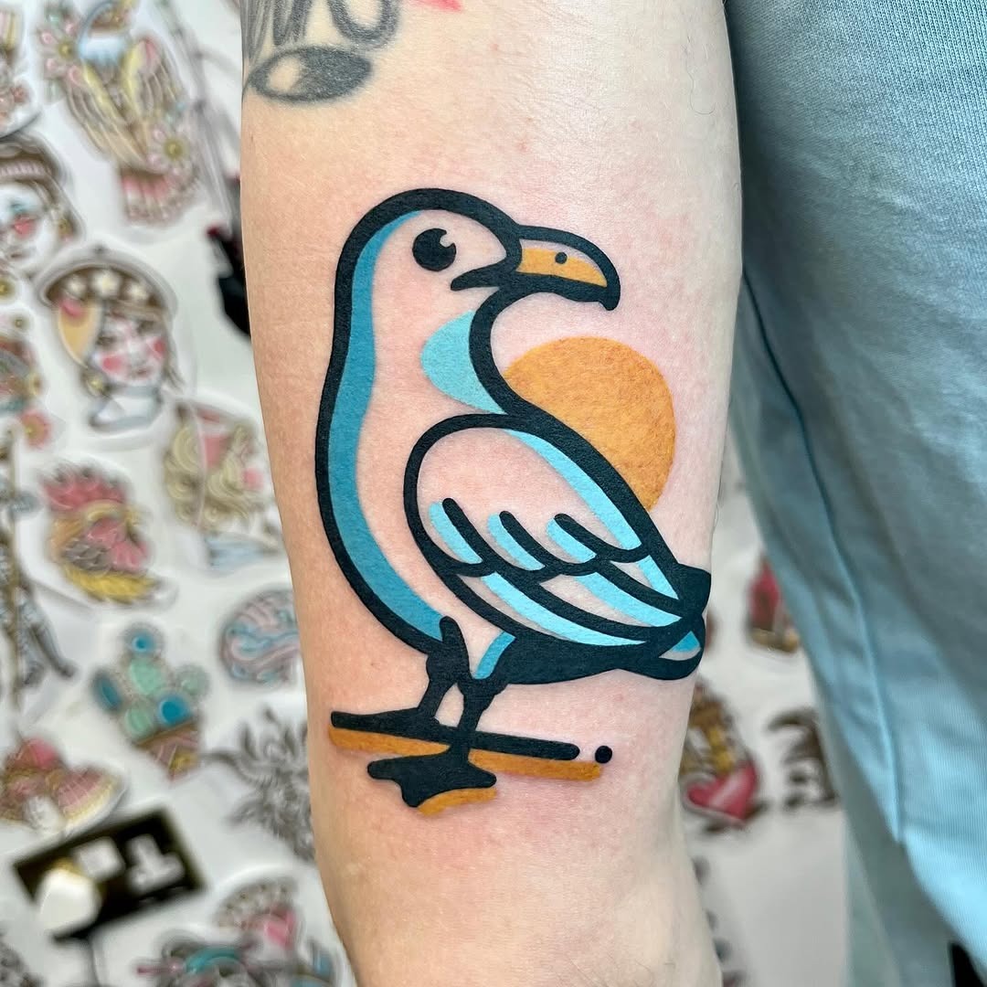 Vibrant Seagull Tattoo with Sunrise Elements Tattoo Design