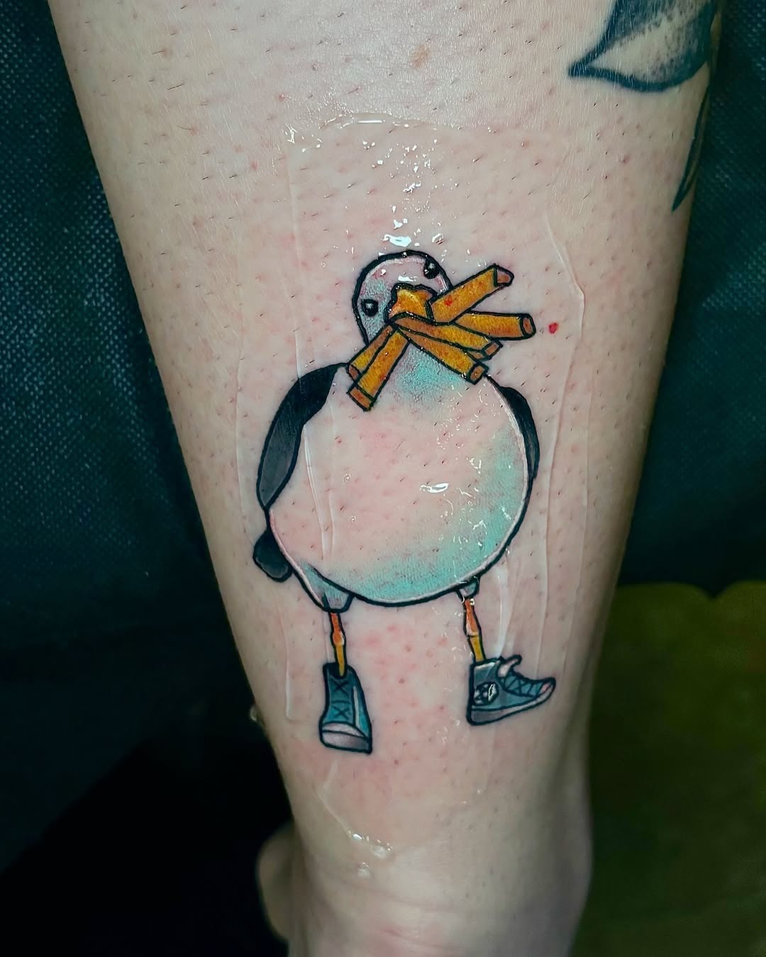 Whimsical seagull with fries and shoes tattoo Tattoo Design