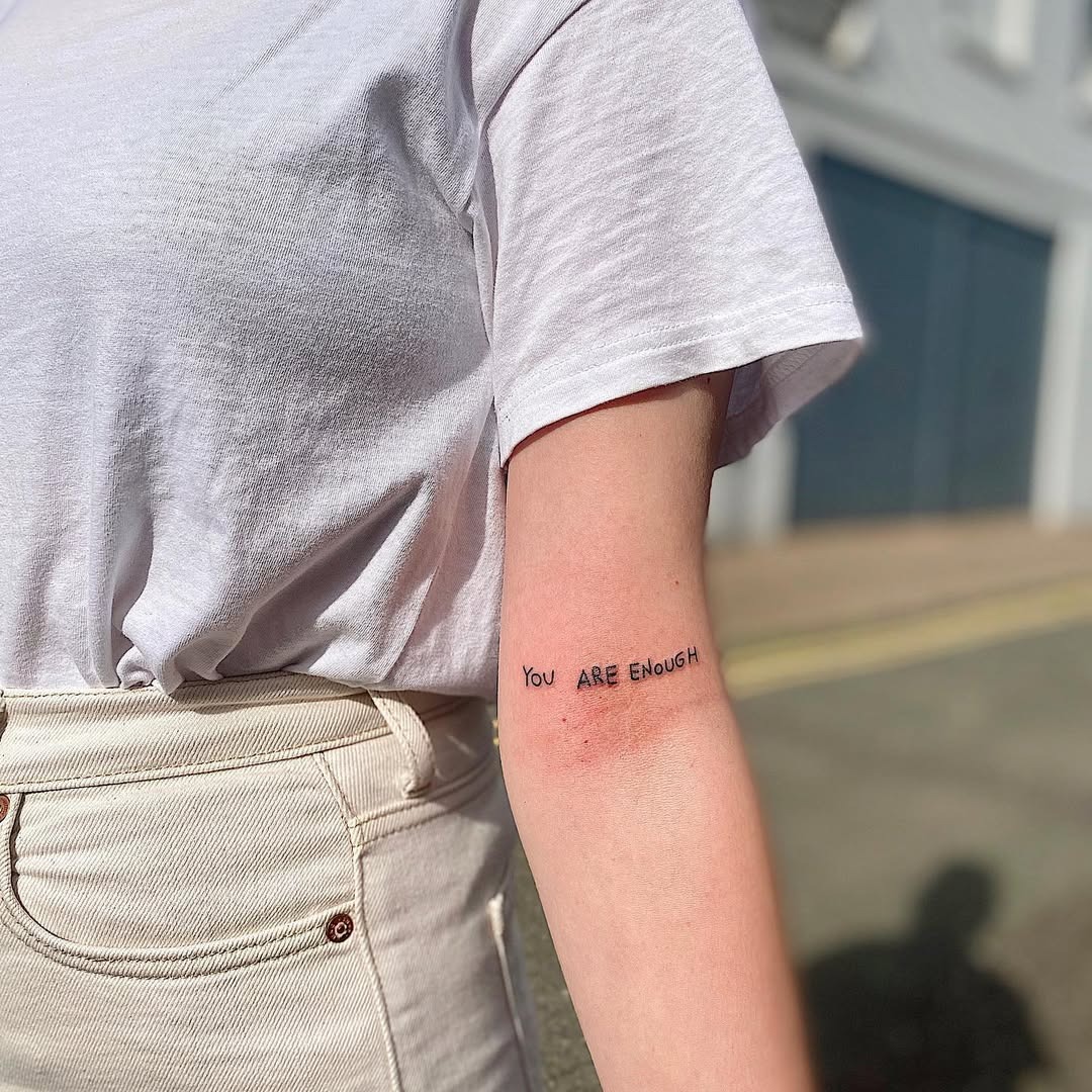 Empowering affirmation tattoo on the arm Tattoo Design