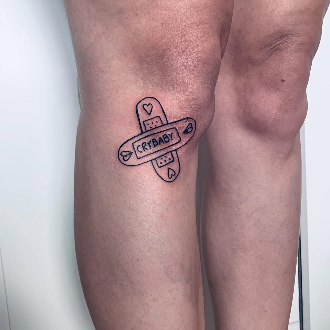 Playful bandaid tattoo embodying self-love Tattoo Design