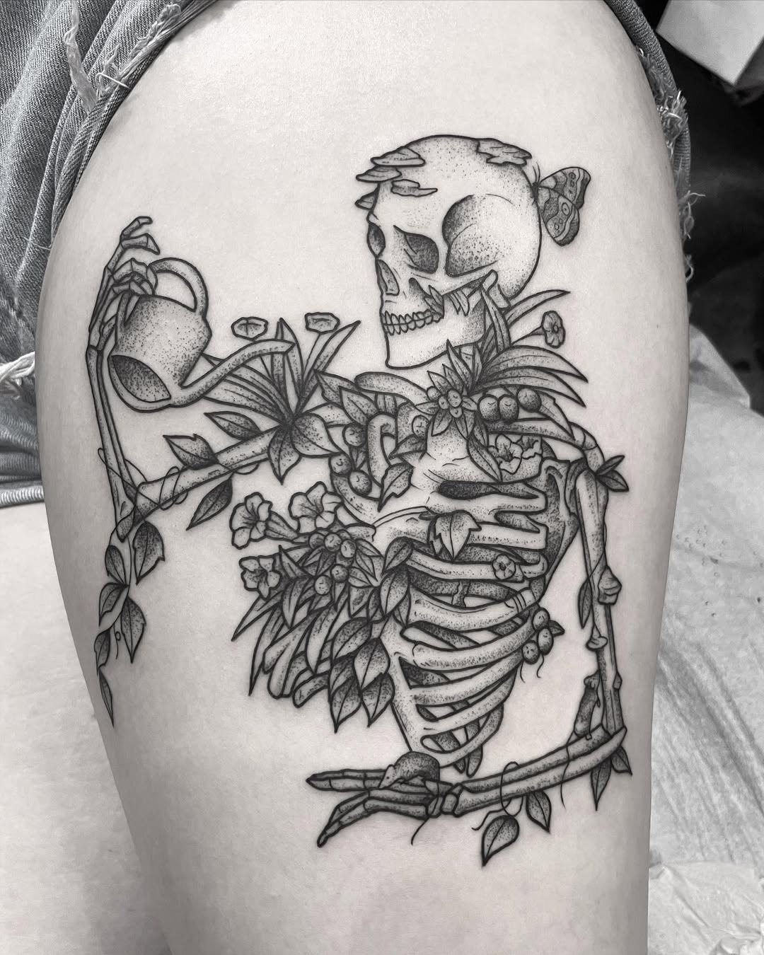 Whimsical skeleton tattoo with floral elements Tattoo Design