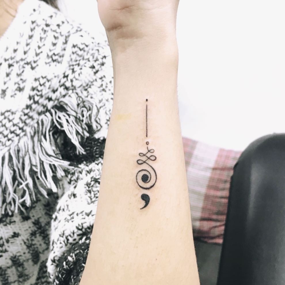 Elegant minimalist semicolon tattoo on forearm Tattoo Design