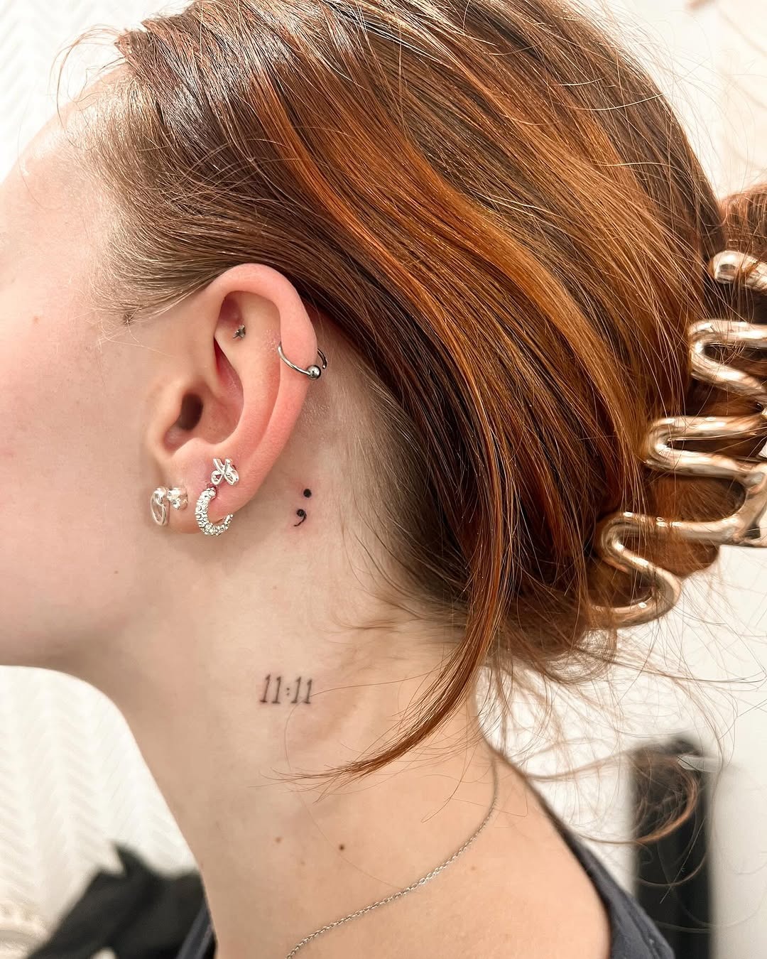 Elegant semicolon tattoo behind the ear Tattoo Design