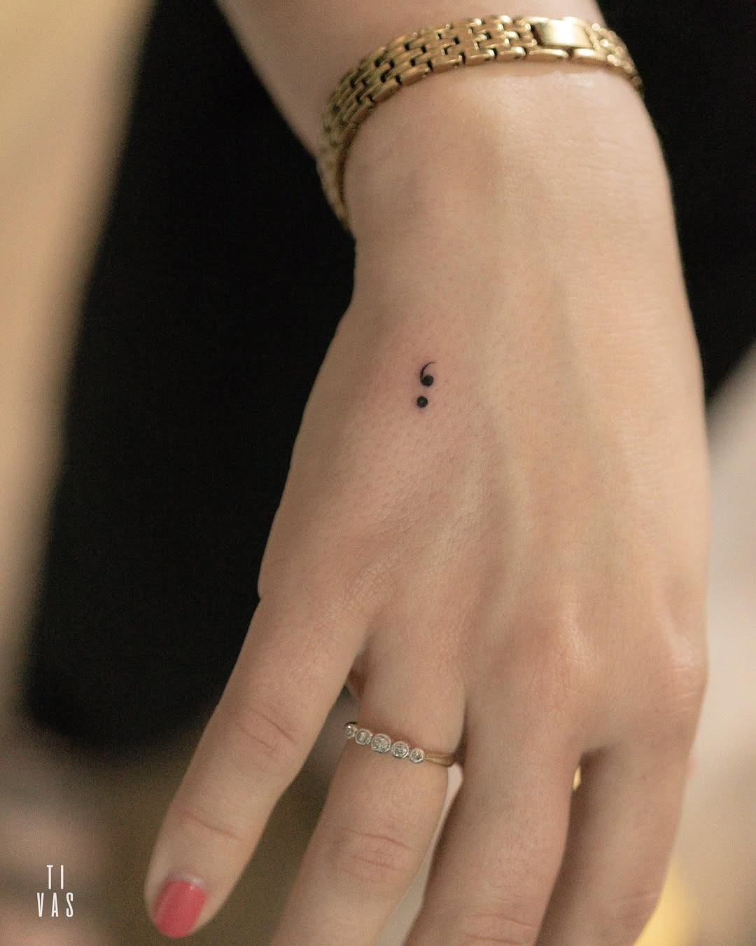 Minimalist semicolon tattoo on a wrist Tattoo Design