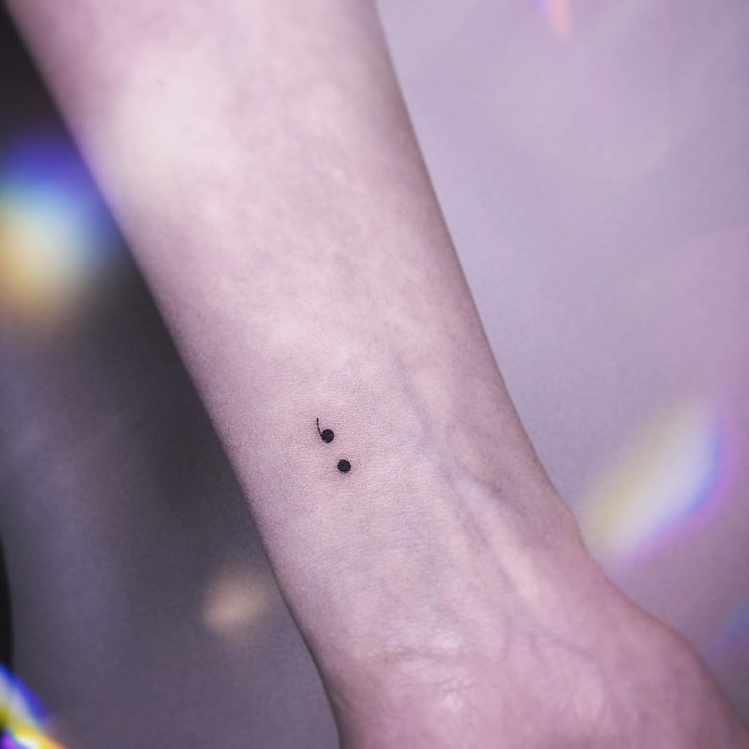 Minimalist semicolon tattoo on forearm Tattoo Design
