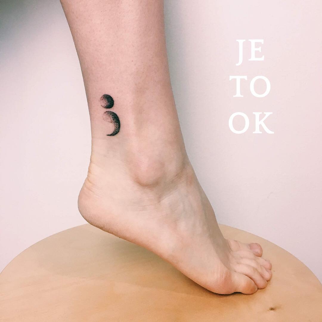 Minimalist semicolon tattoo on the ankle Tattoo Design