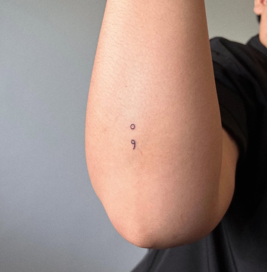 Minimalist semicolon tattoo on the elbow Tattoo Design