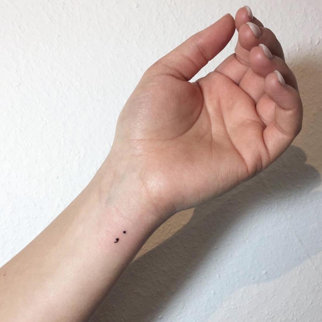 Minimalistic semicolon tattoo on the wrist Tattoo Design