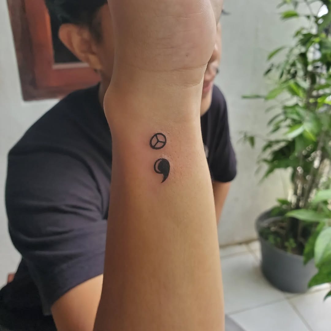 Stylish minimalist semicolon tattoo on forearm Tattoo Design