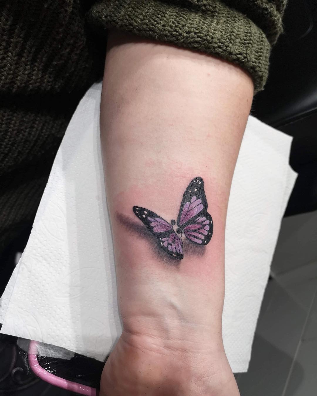 Vibrant Butterfly Tattoo on Inner Forearm Tattoo Design