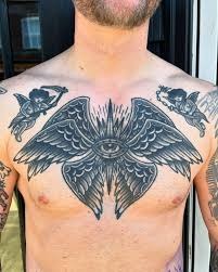 Dark Layered Wings with Hidden Eye Tattoo Design