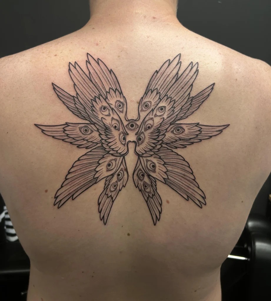 Radiant Seraphim Wings with a Central Eye Tattoo Design