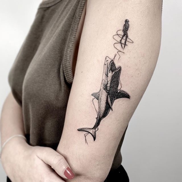 Artistic depiction of a shark and fisherman tattoo Tattoo Design