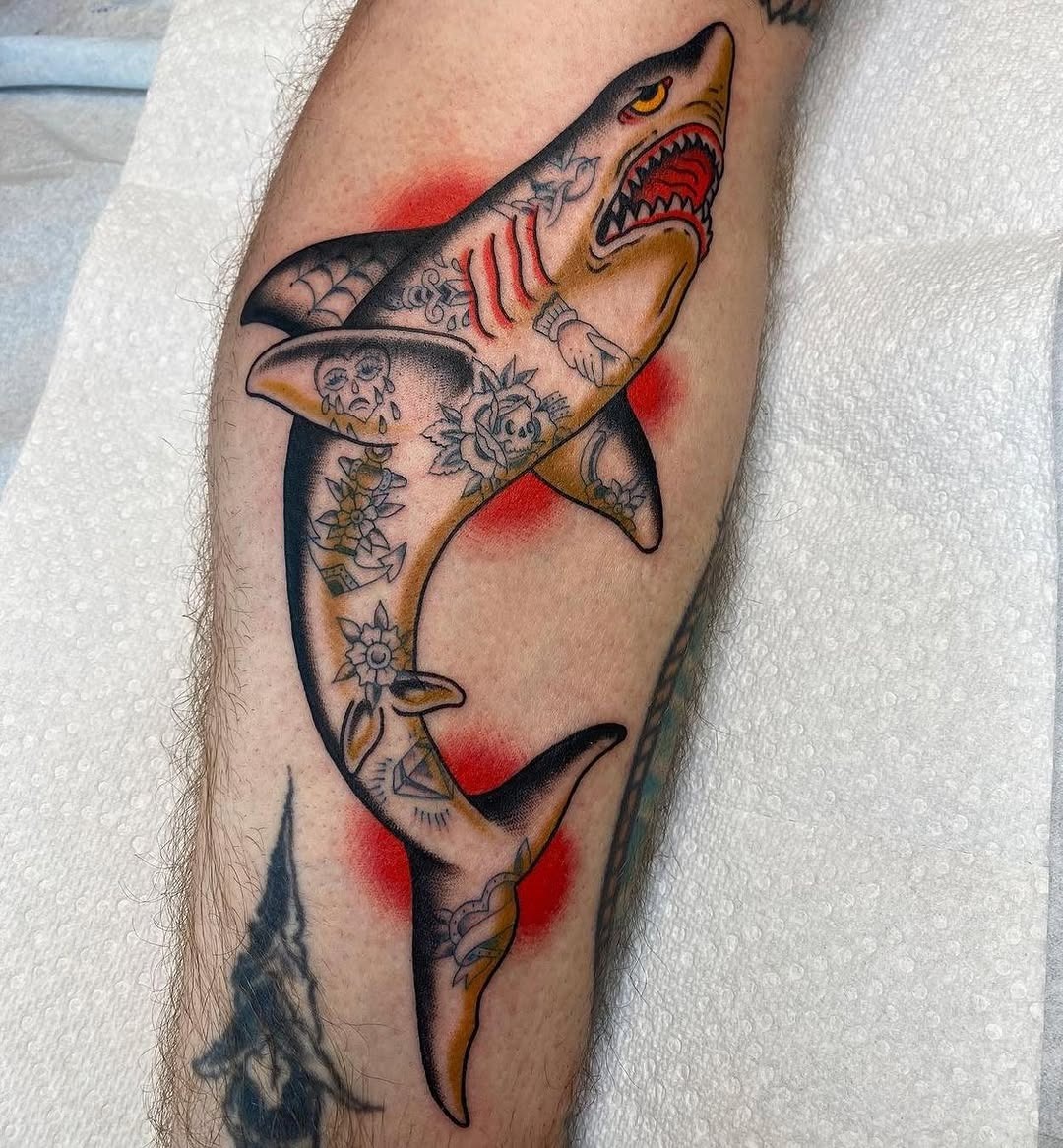 Bold shark tattoo with vibrant colors and details Tattoo Design