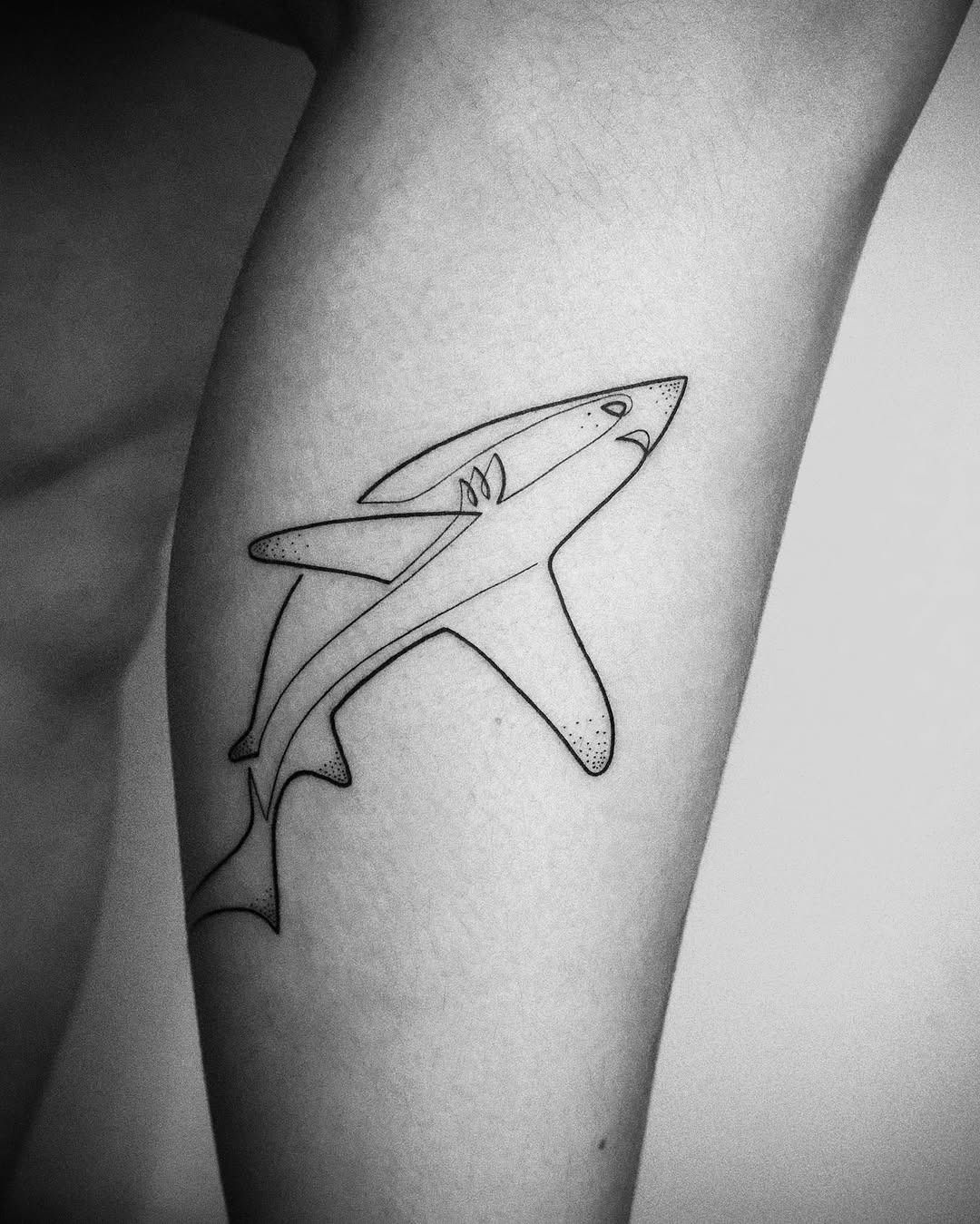 Sleek black and white shark tattoo design Tattoo Design