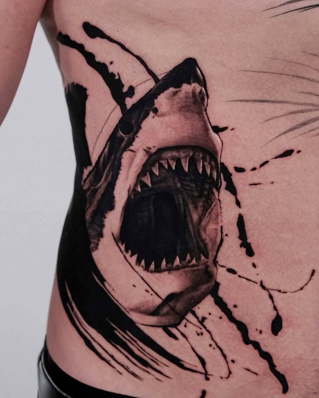 Stunning aggressive shark tattoo on ribcage Tattoo Design