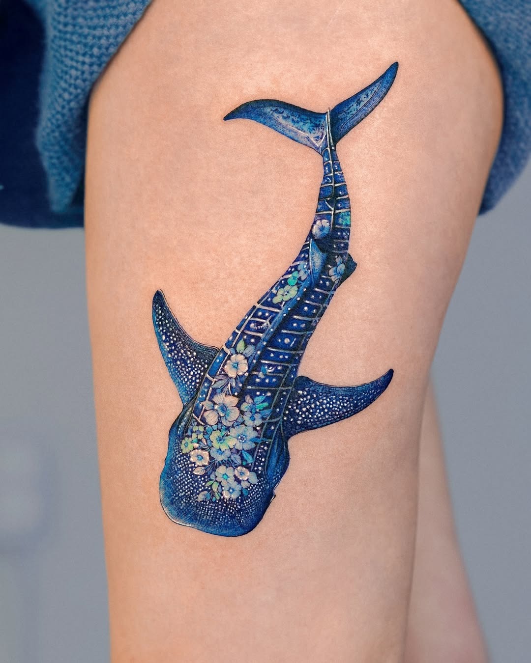 Stunning blue shark tattoo with floral accents Tattoo Design