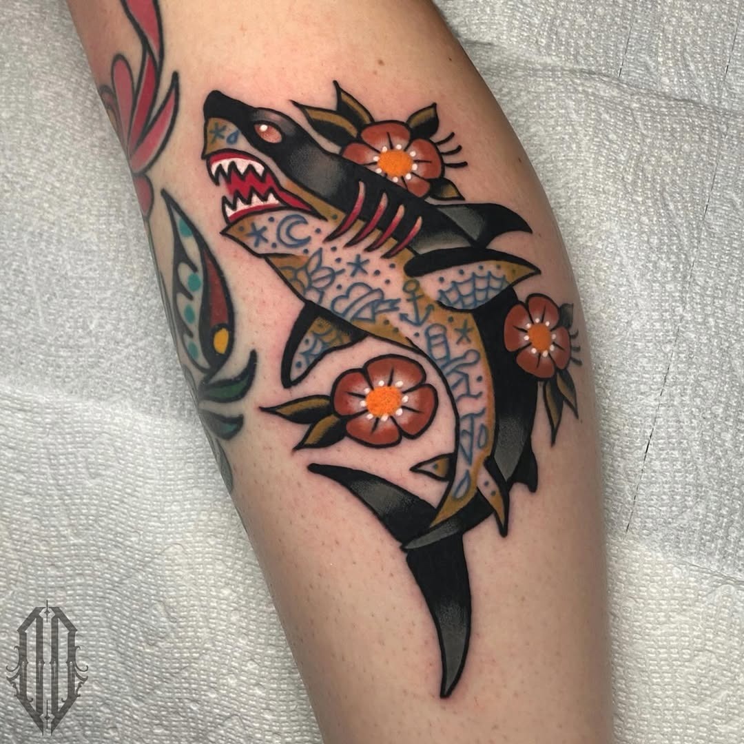 Vibrant shark tattoo adorned with floral elements Tattoo Design