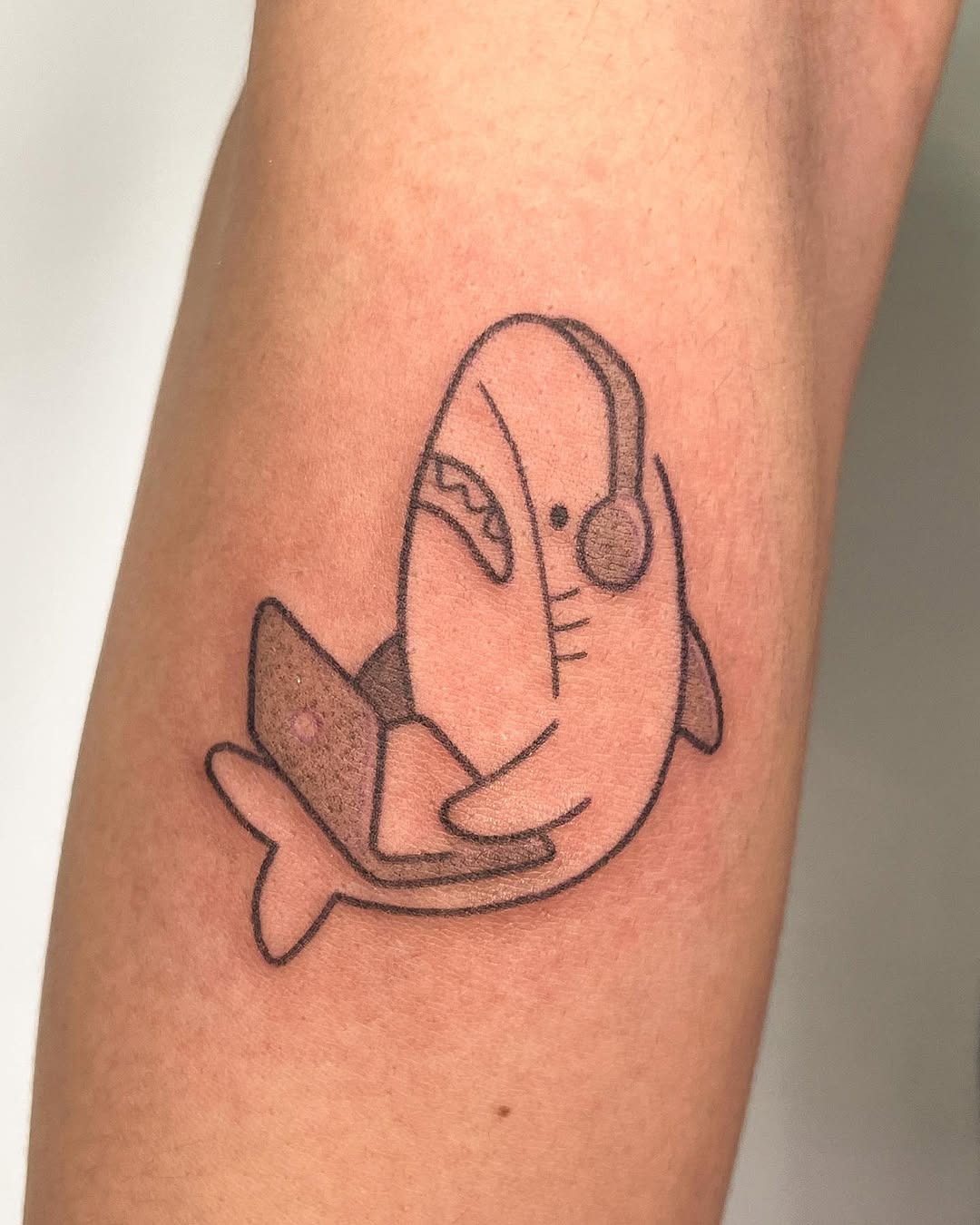 Whimsical shark tattoo with a modern twist Tattoo Design