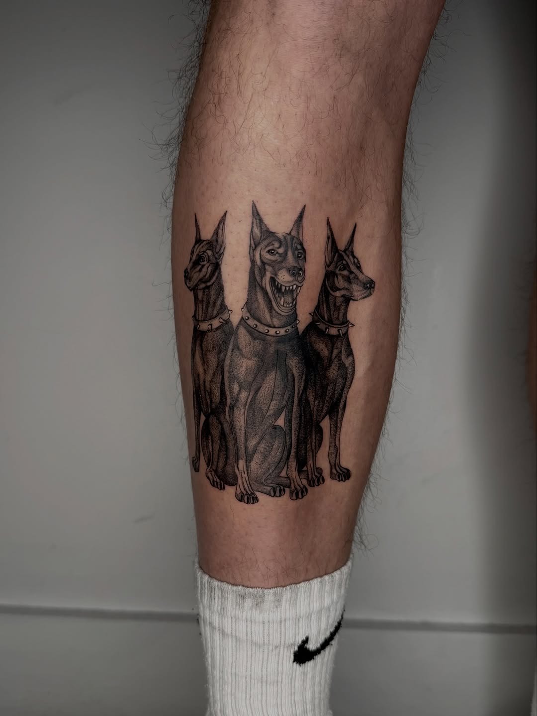 Bold black ink dog tattoo design on shin Tattoo Design