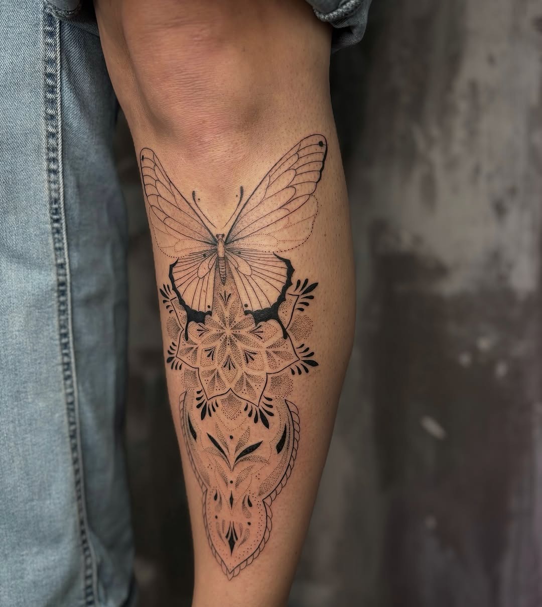 Elegant butterfly tattoo on the shin area Tattoo Design