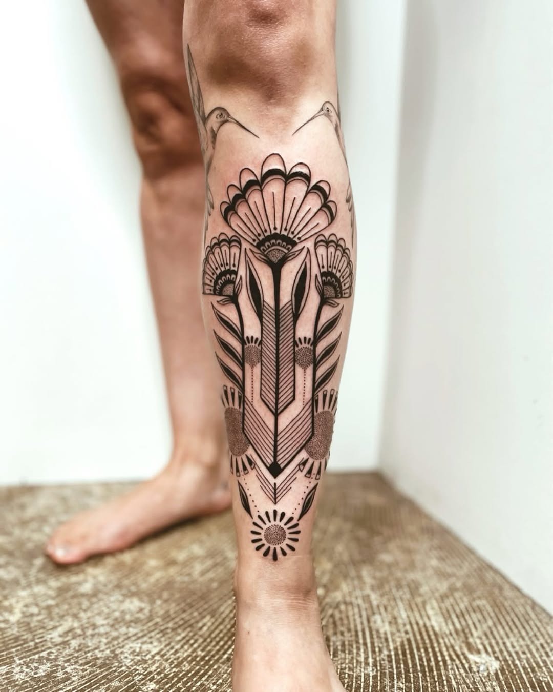 Elegant floral and geometric shin tattoo design Tattoo Design