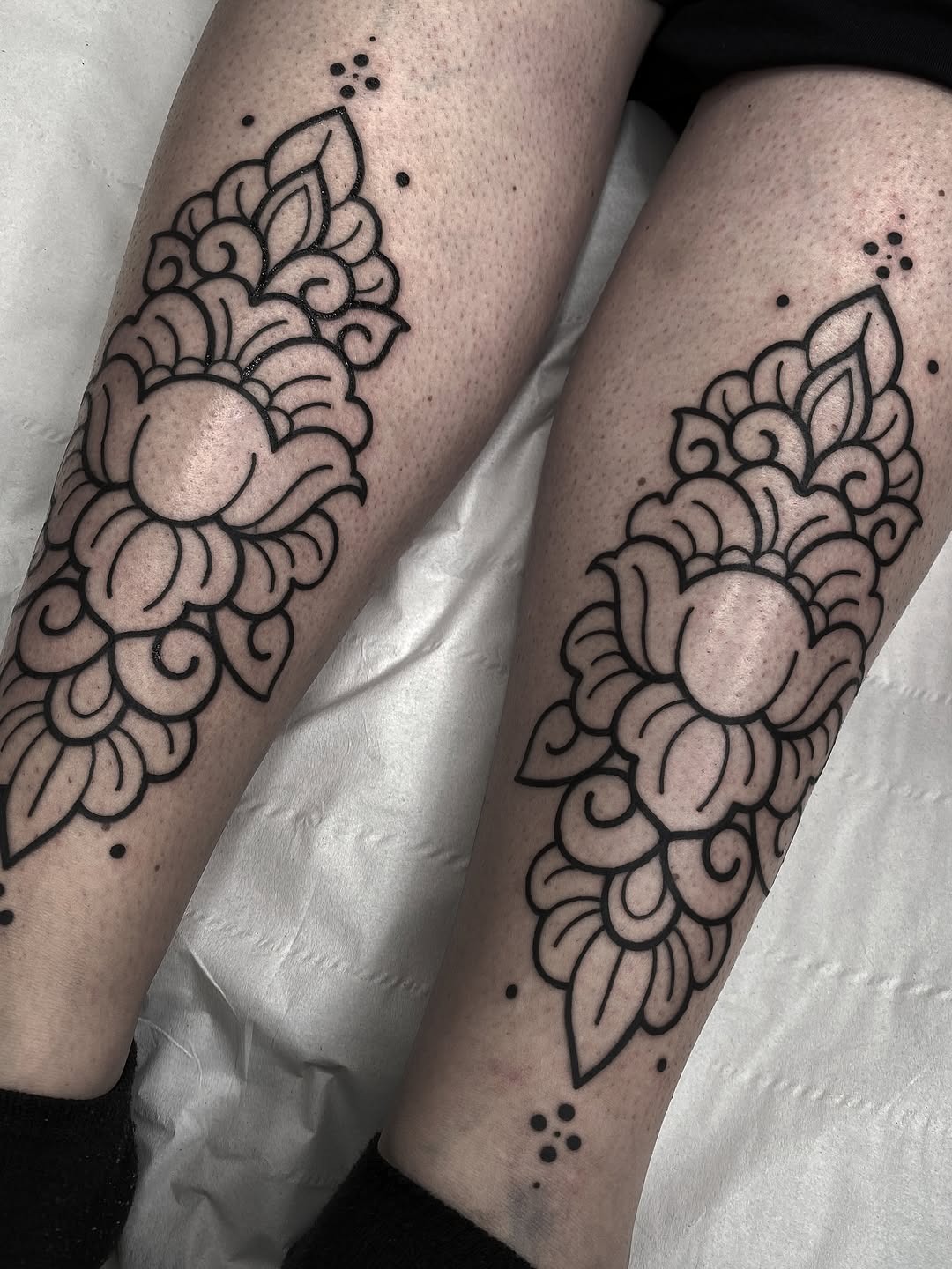Elegant floral pattern tattoos on shins Tattoo Design