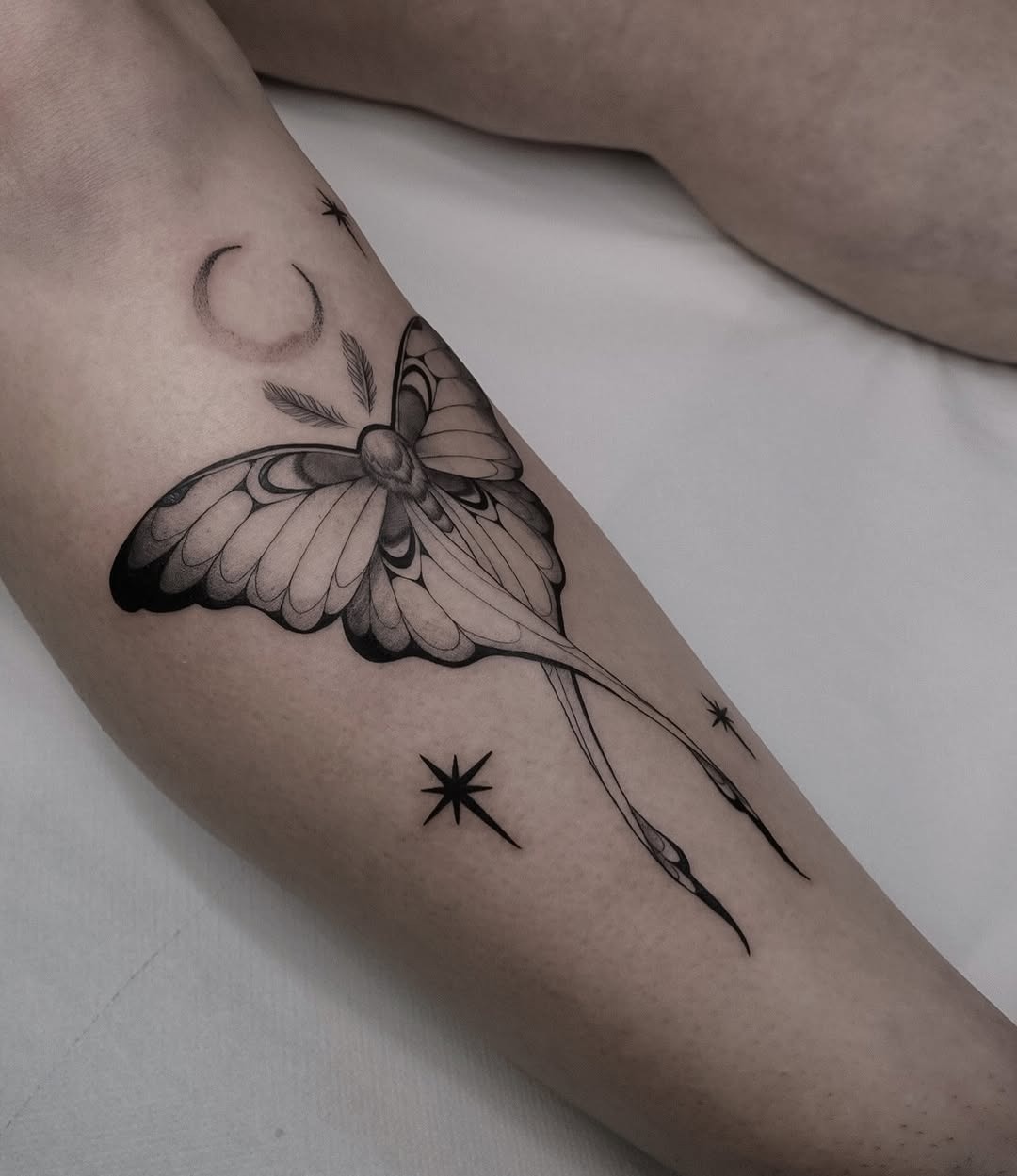 Stunning butterfly tattoo with celestial elements Tattoo Design