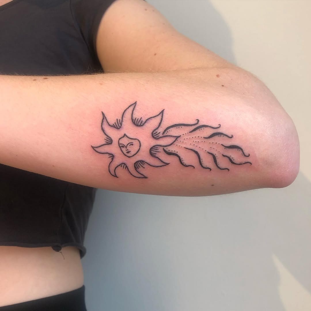 Charming shooting star tattoo with a sun design Tattoo Design