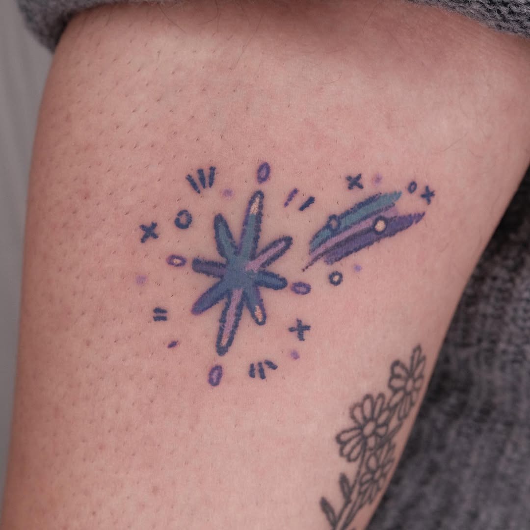 Colorful shooting star tattoo with dynamic flair Tattoo Design