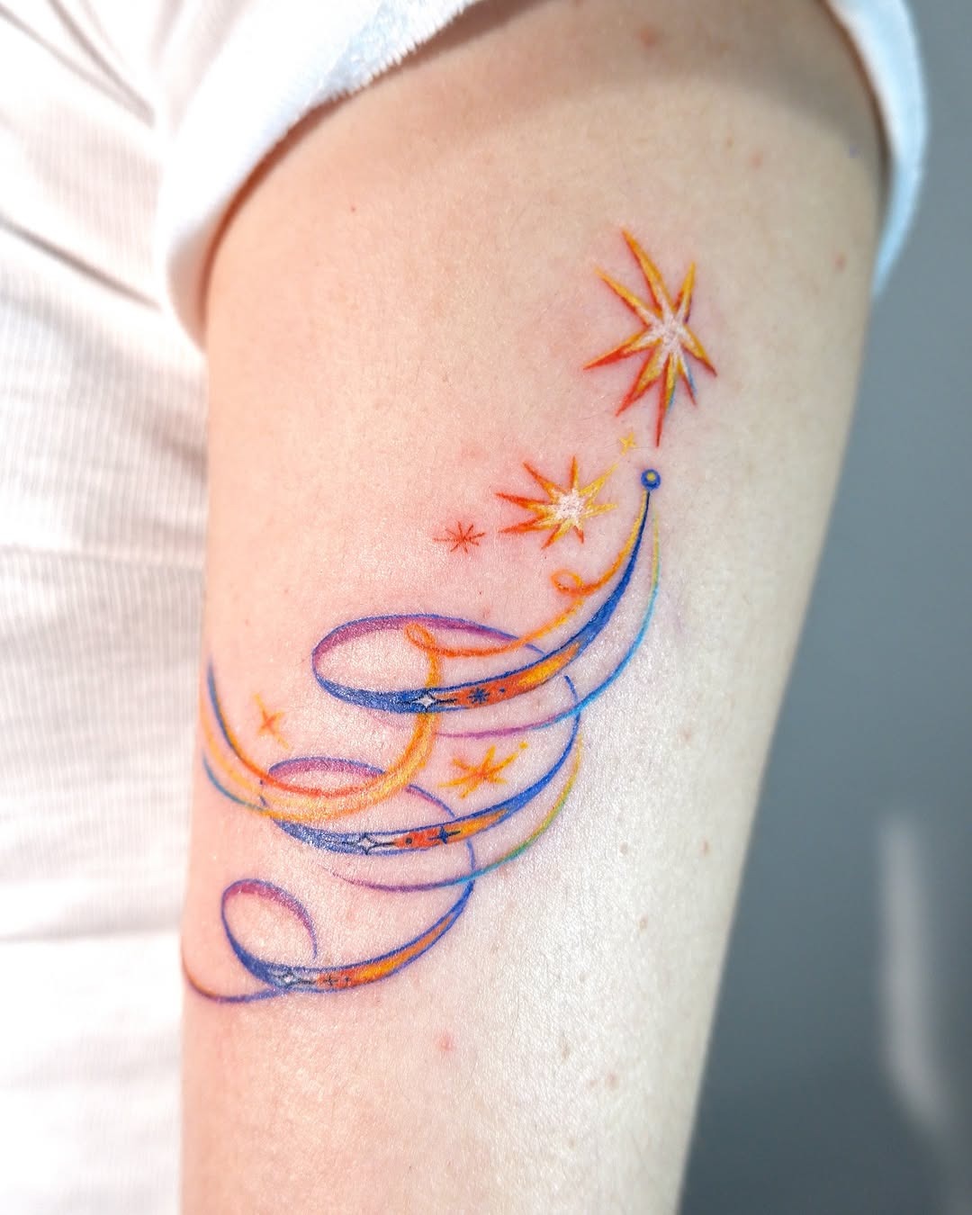 Colorful shooting star tattoo with ribbons Tattoo Design