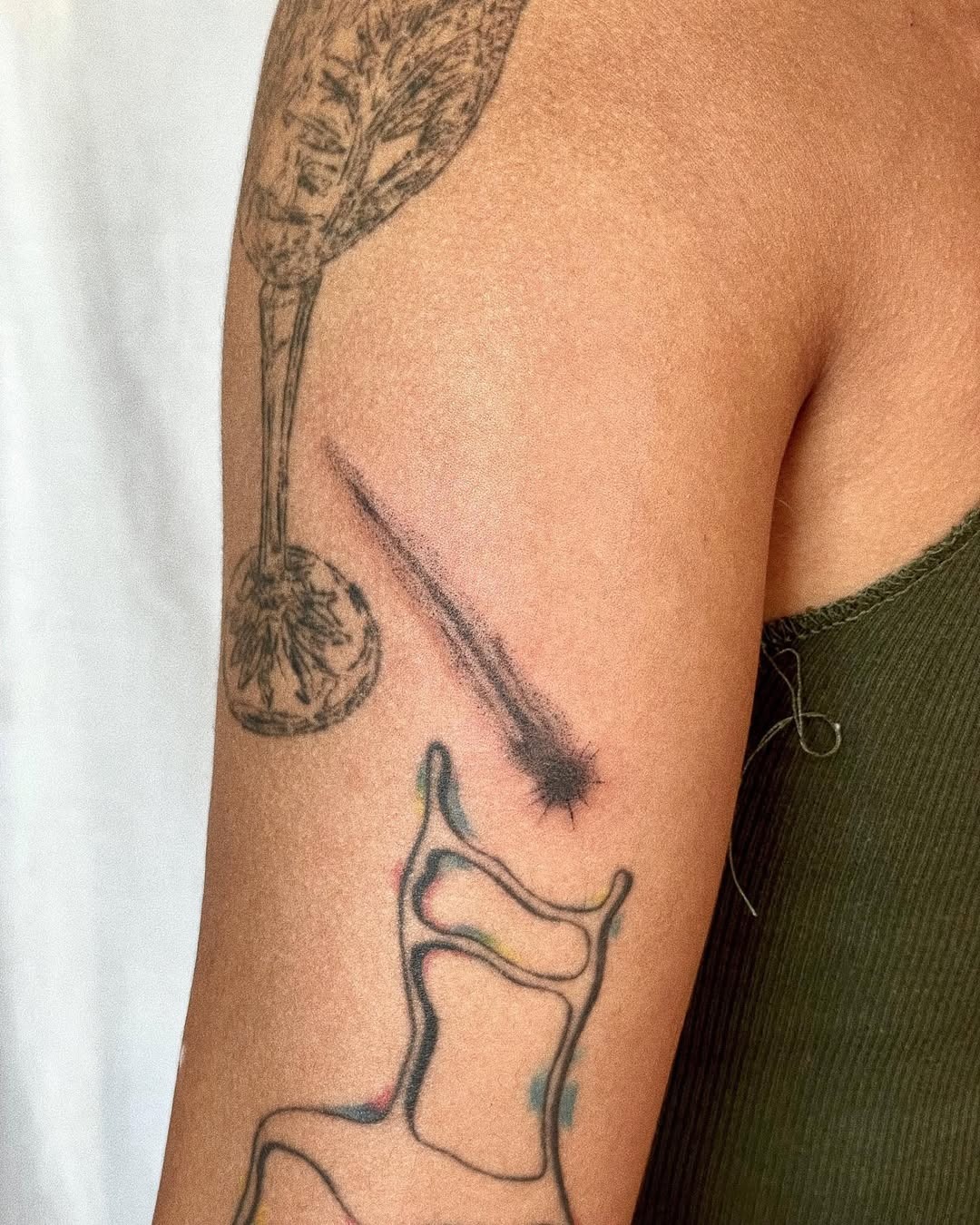 Elegant shooting star tattoo on the arm Tattoo Design