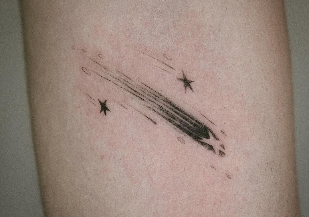 Sleek and minimal shooting star tattoo design Tattoo Design