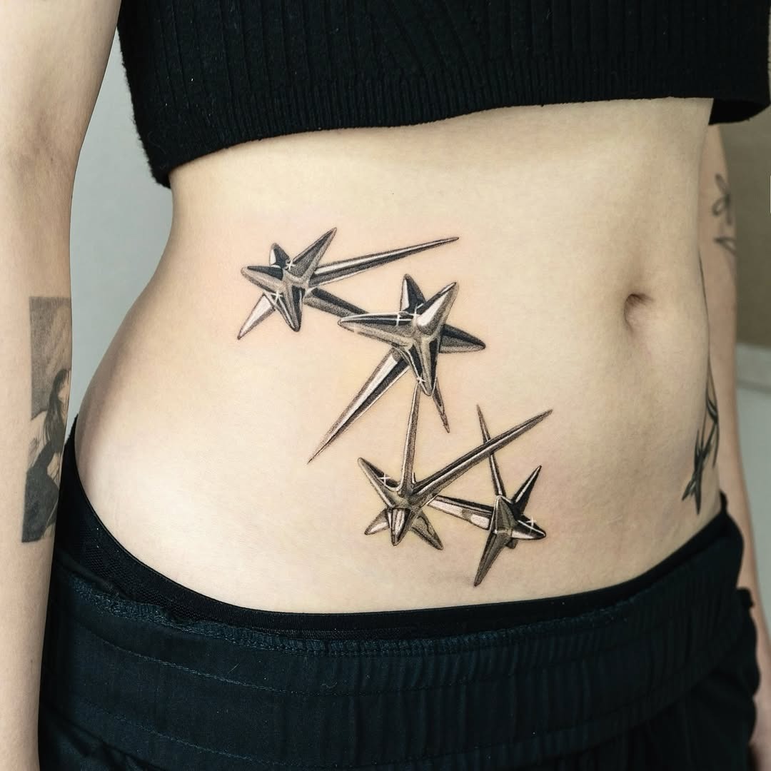Stunning tattoo showcasing graceful shooting stars Tattoo Design