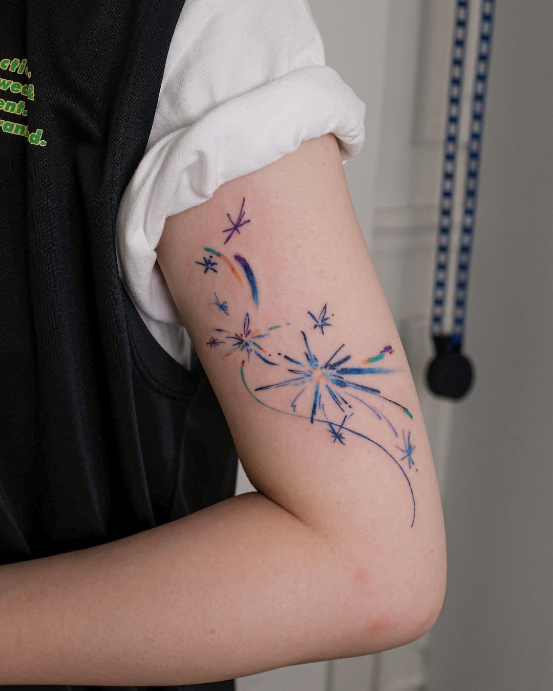 Vibrant shooting star tattoo on the arm Tattoo Design