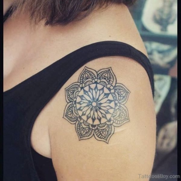 This intricate mandala tattoo showcases the beauty of geometric symmetry, making it a bold for women mandalas design.