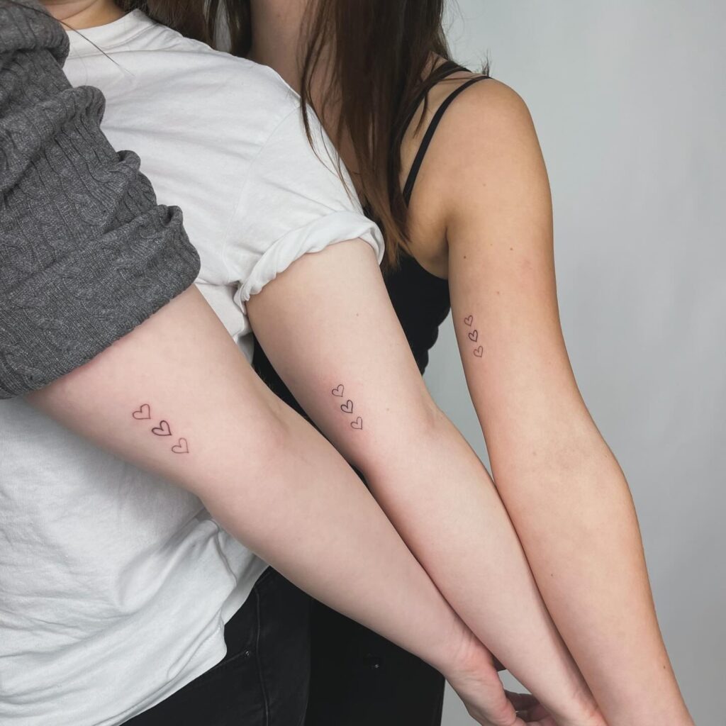 Matching Three Heart Outline Tattoos for Siblings Tattoo Design