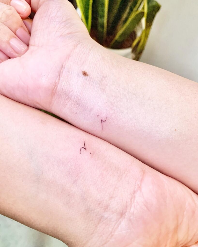 Minimalist Matching Wrist Tattoos for Siblings Tattoo Design