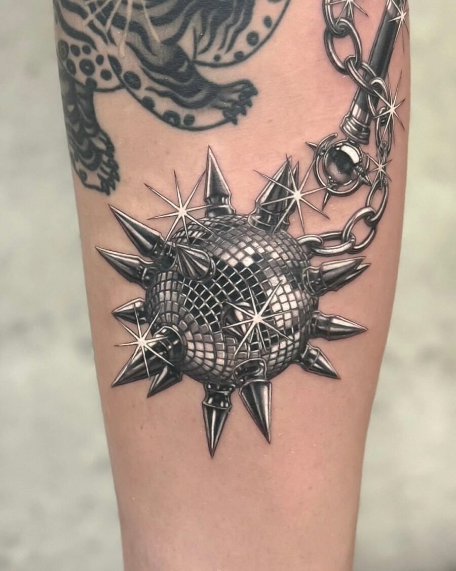 Edgy spiked tattoo with a silver sheen Tattoo Design